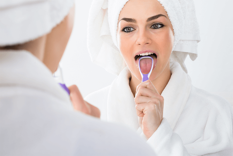 Cleaning your tongue Twenty One dental clinic dentist Brighton Hove